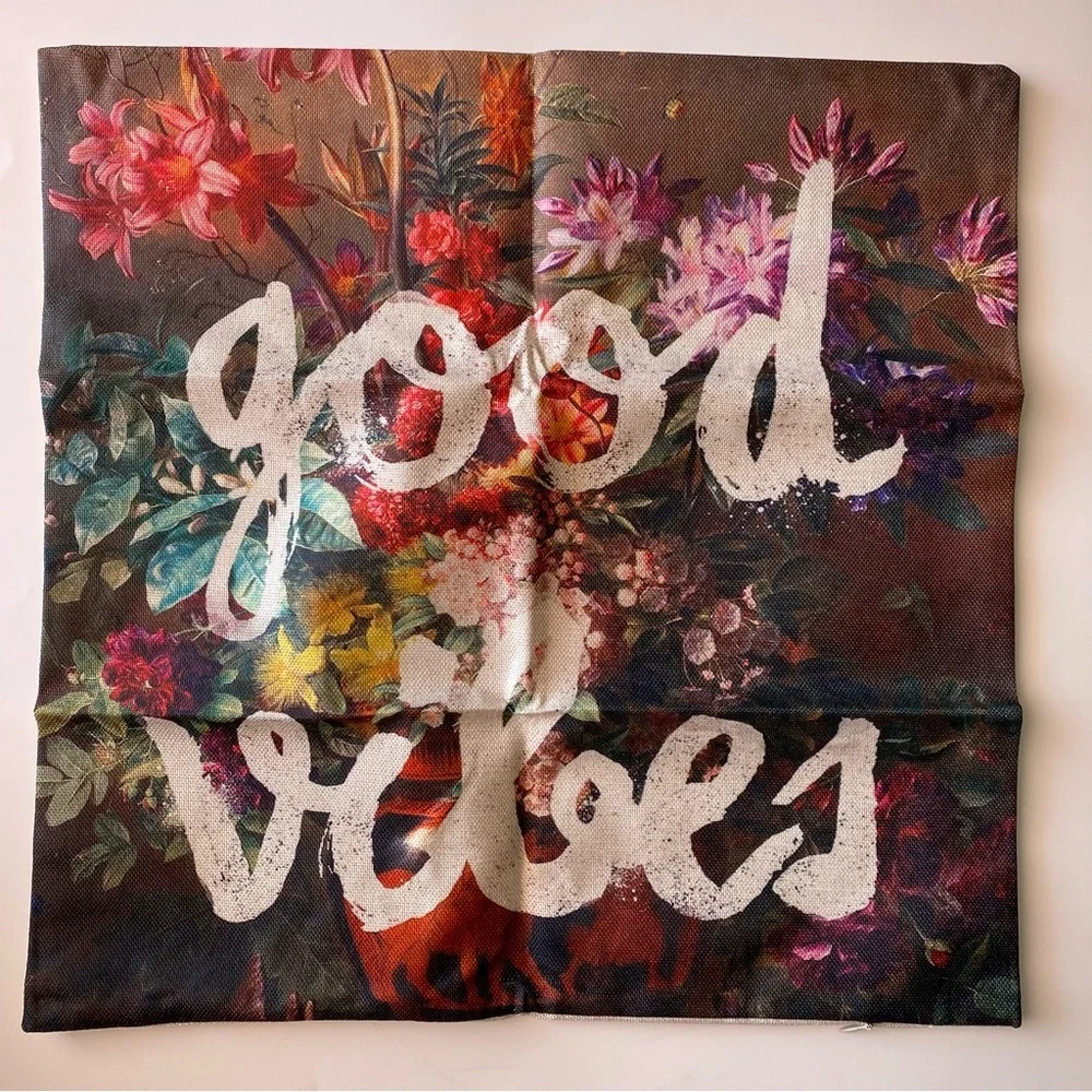 Good vibes graffiti over floral print canvas pillow cover